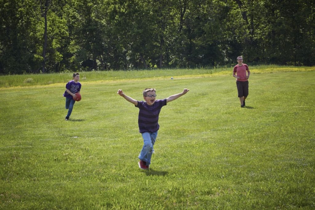 Children play in a field