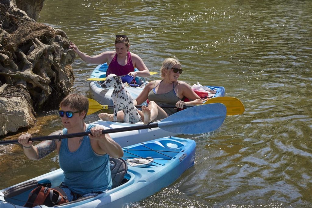 People pose during a kayak trip